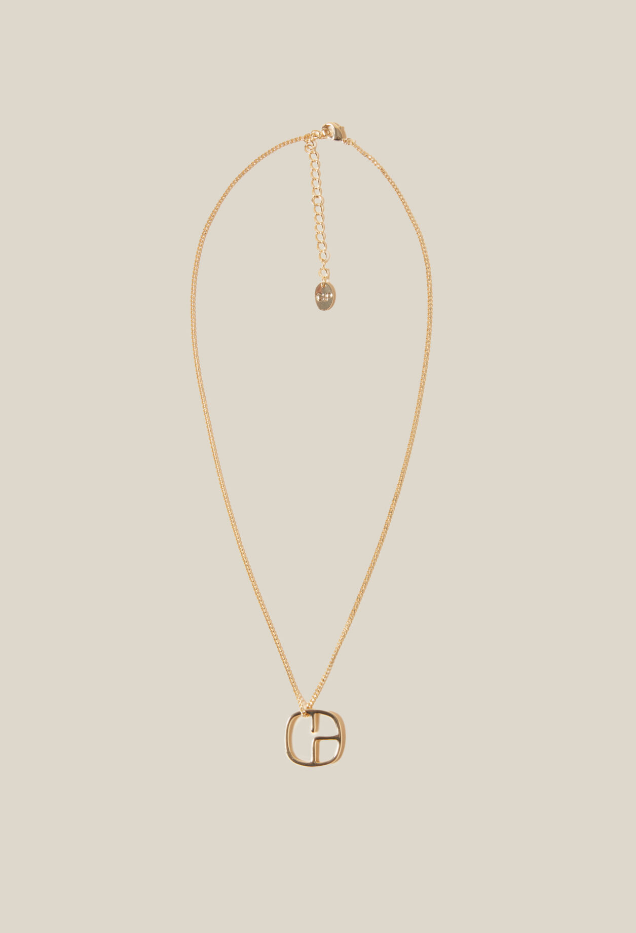 Collier pendentif monogramme doré