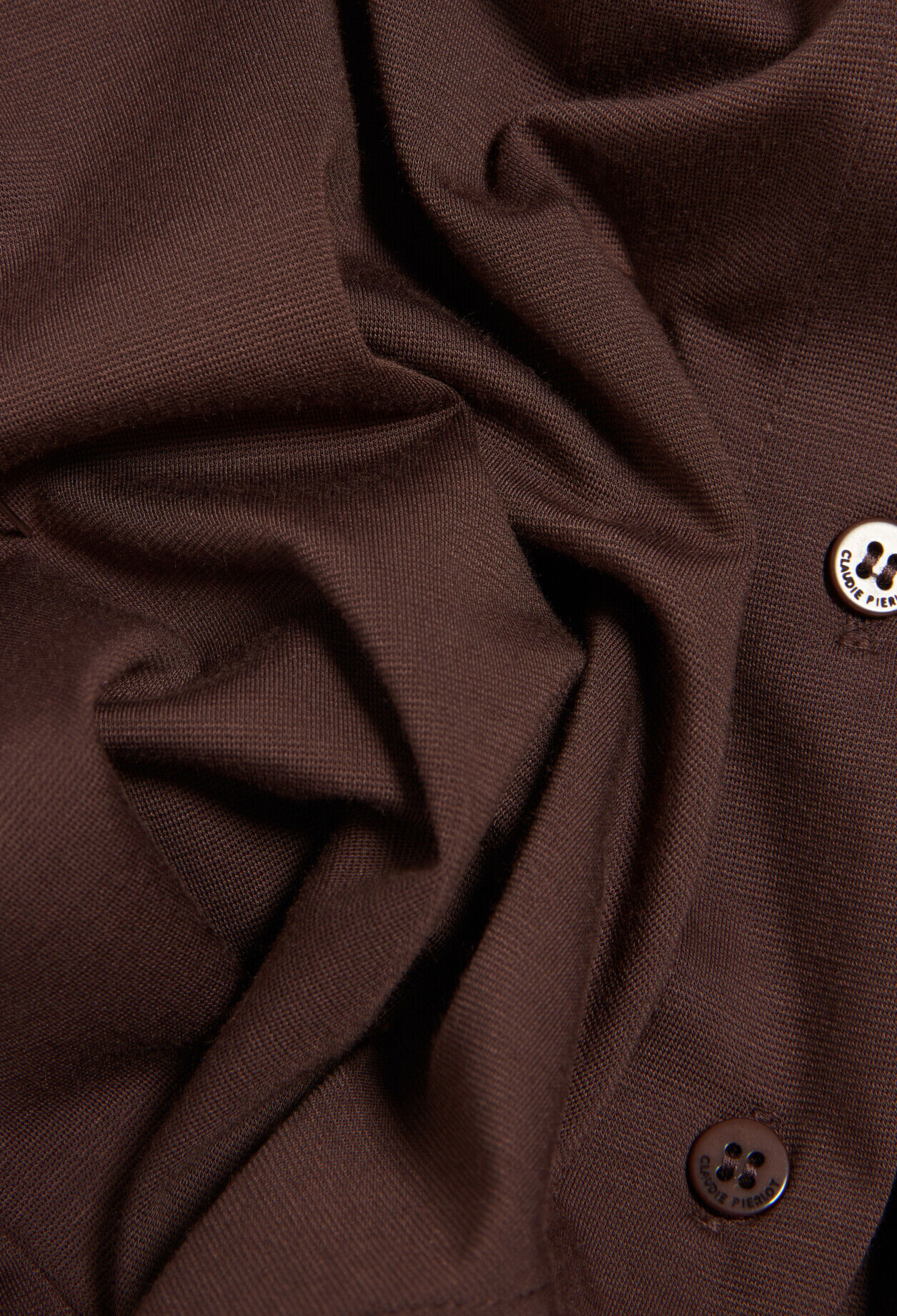 Black asymmetric button-up top