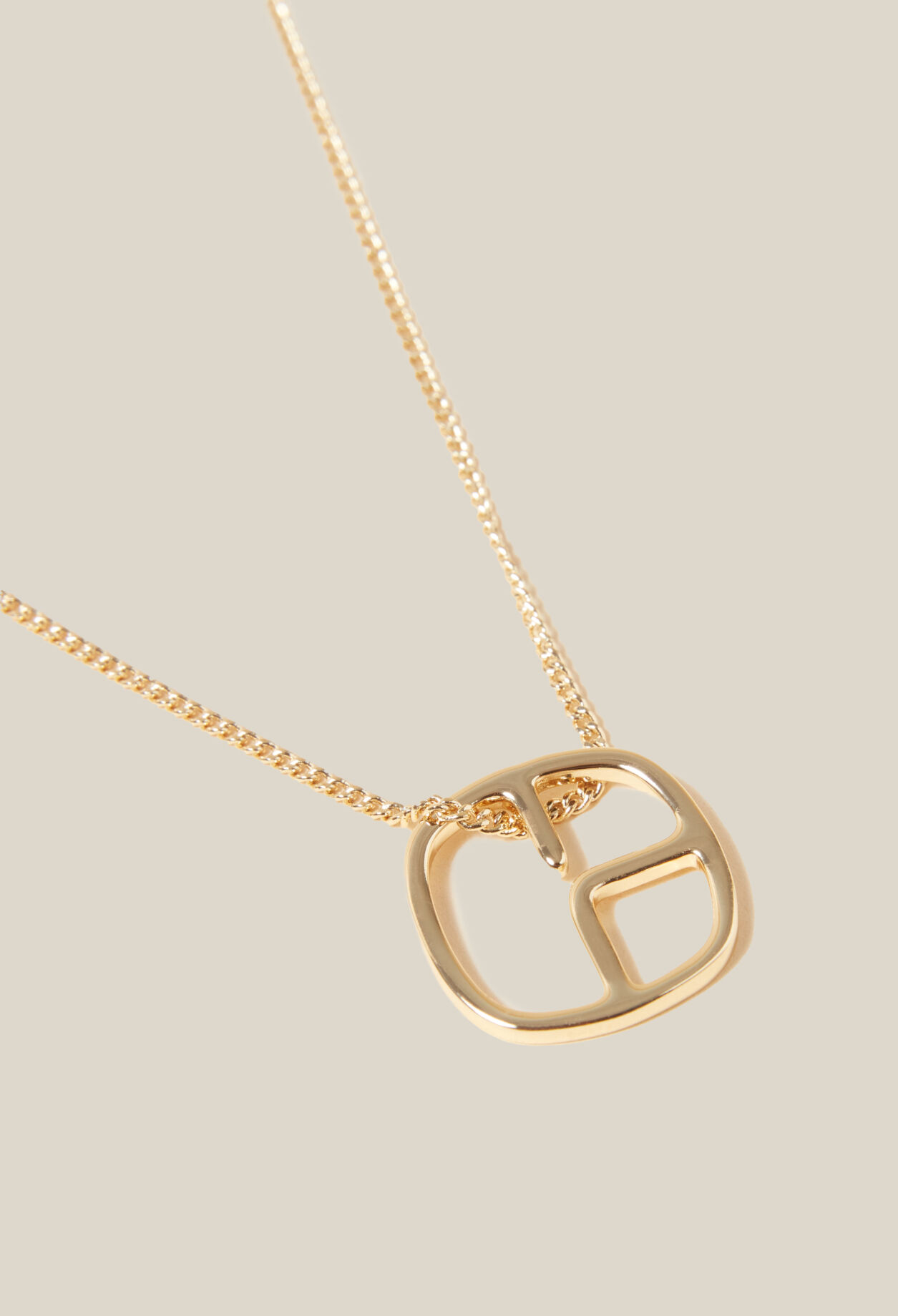 Collier pendentif monogramme doré